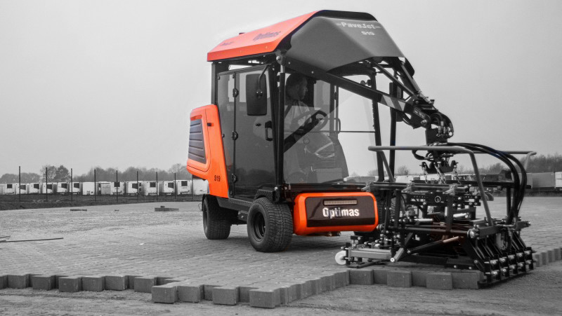 A specialized machine for laying bricks on a construction site, showcasing its unique design and functionality – Optimas.